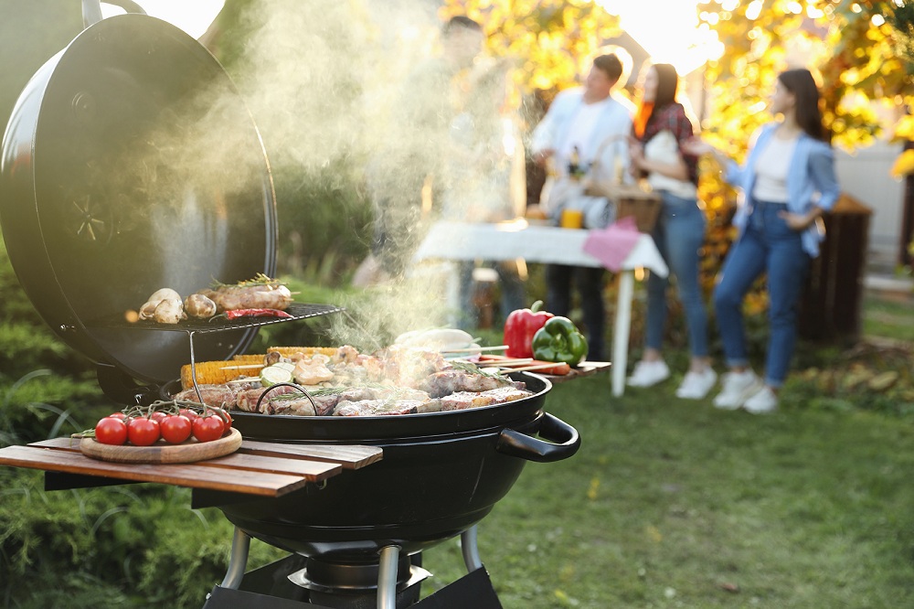 Group,Of,Friends,Having,Party,Outdoors.,Focus,On,Barbecue,Grill